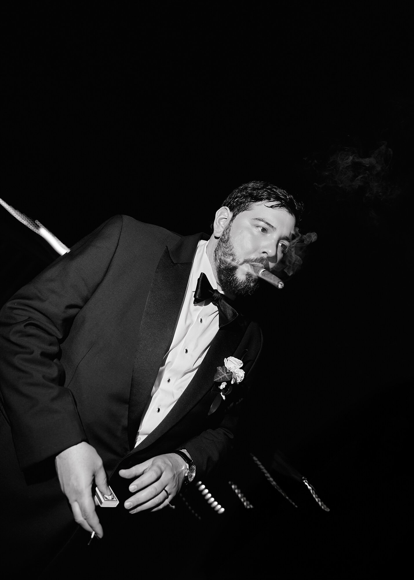 Groom relaxing with a cigar