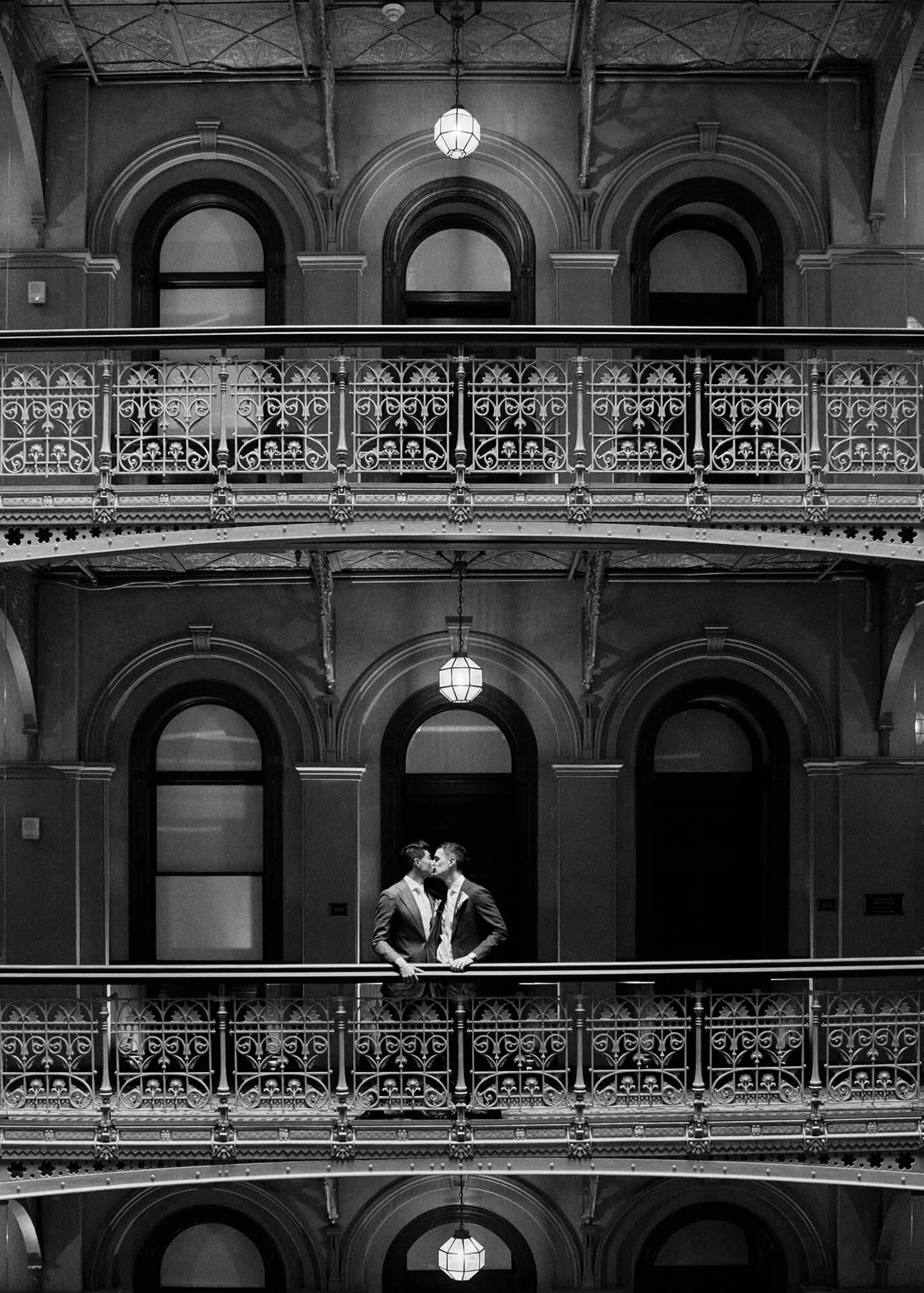 Romantic moment: grooms’ kiss at hotel lobby