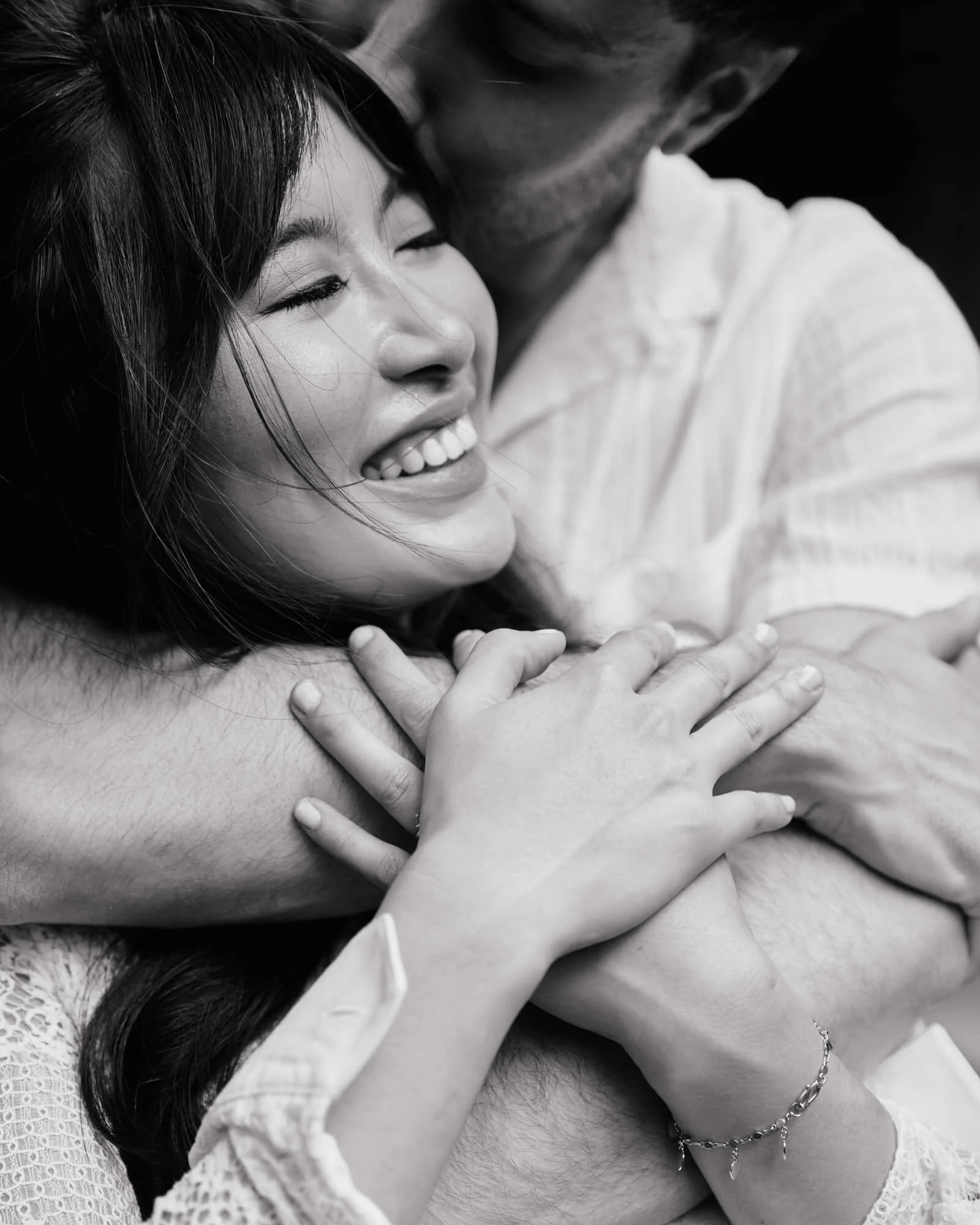 Engagement couple sharing a quiet hug in Brooklyn Heights