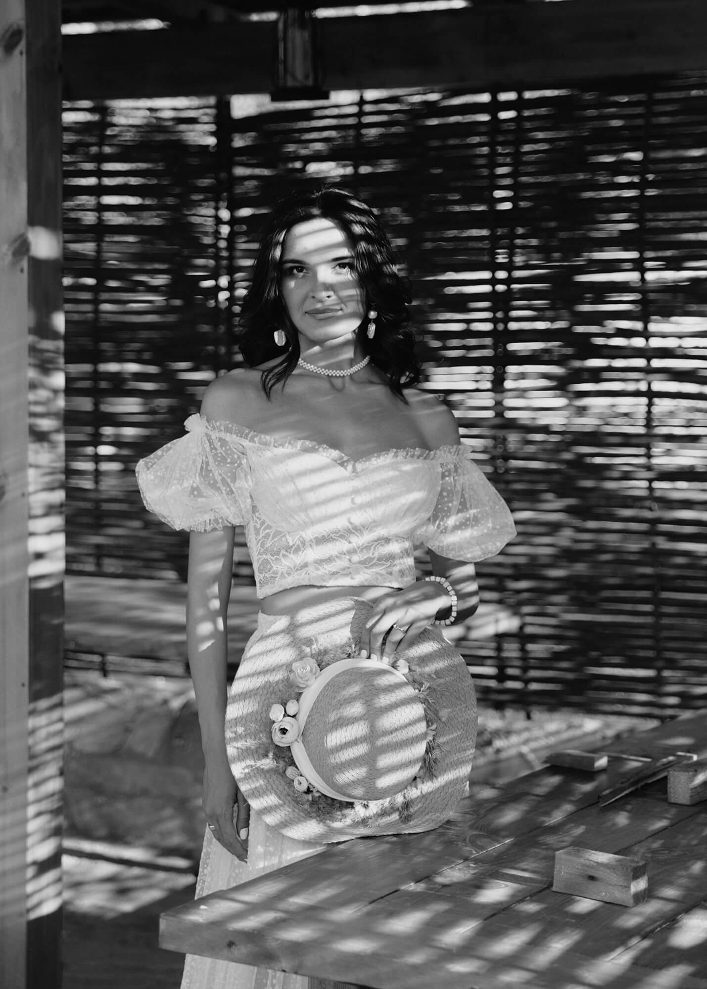 Artistic bridal portrait with shadows in bungalow