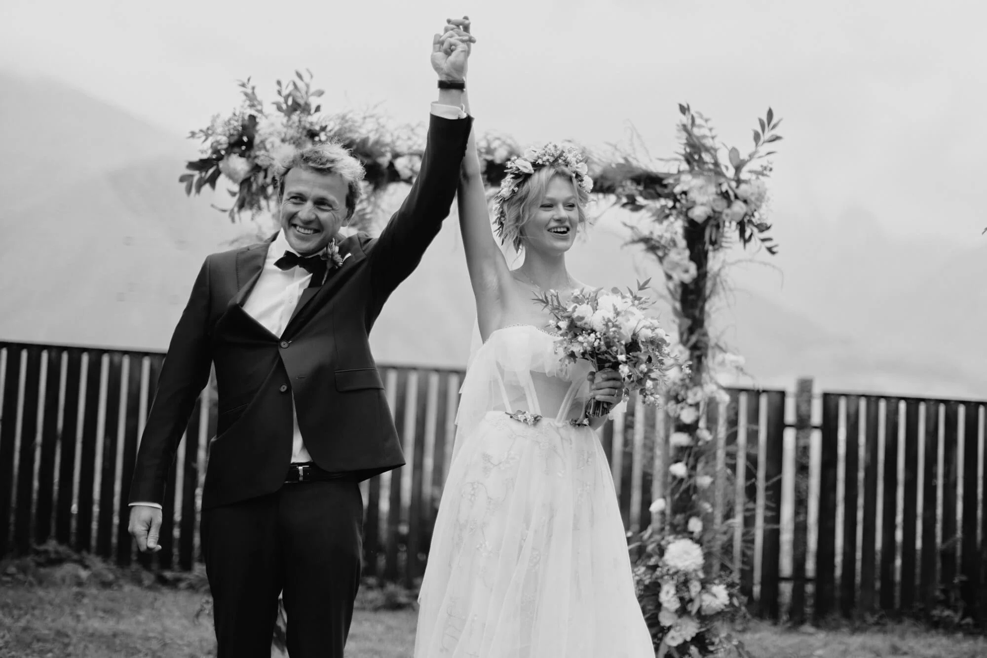 Hands raised in celebration after ceremony