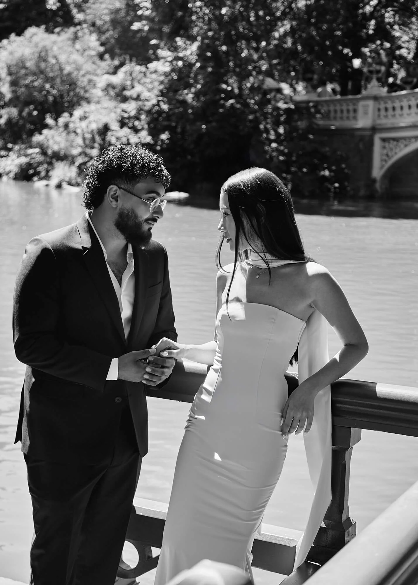 Soft, romantic engagement portrait in Central Park with near kiss
