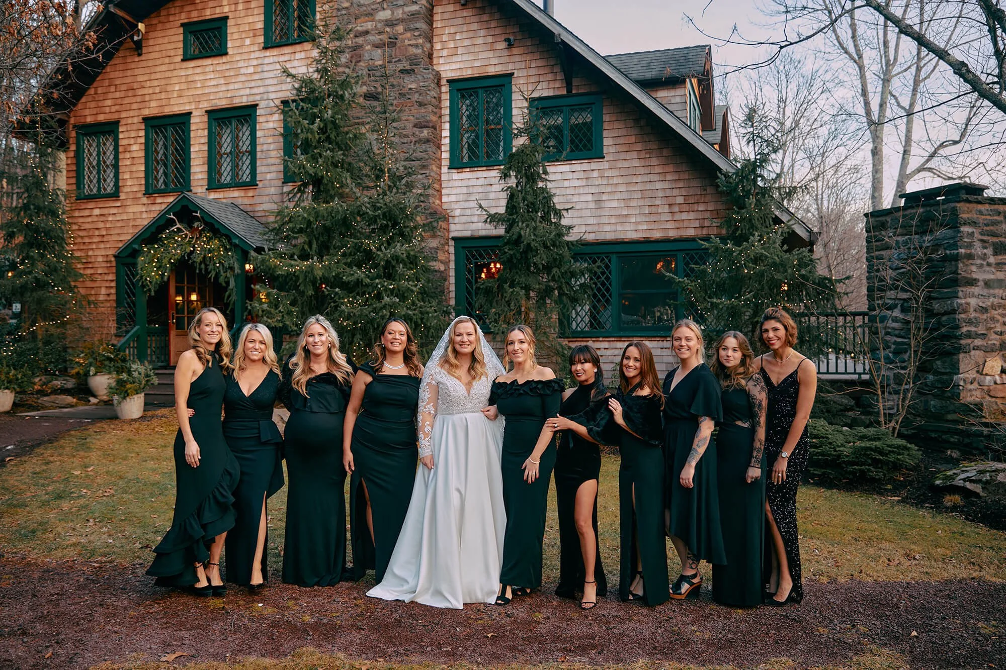 All-girl photo with bride and bridesmaids in front of the venue Deer Mountain Inn