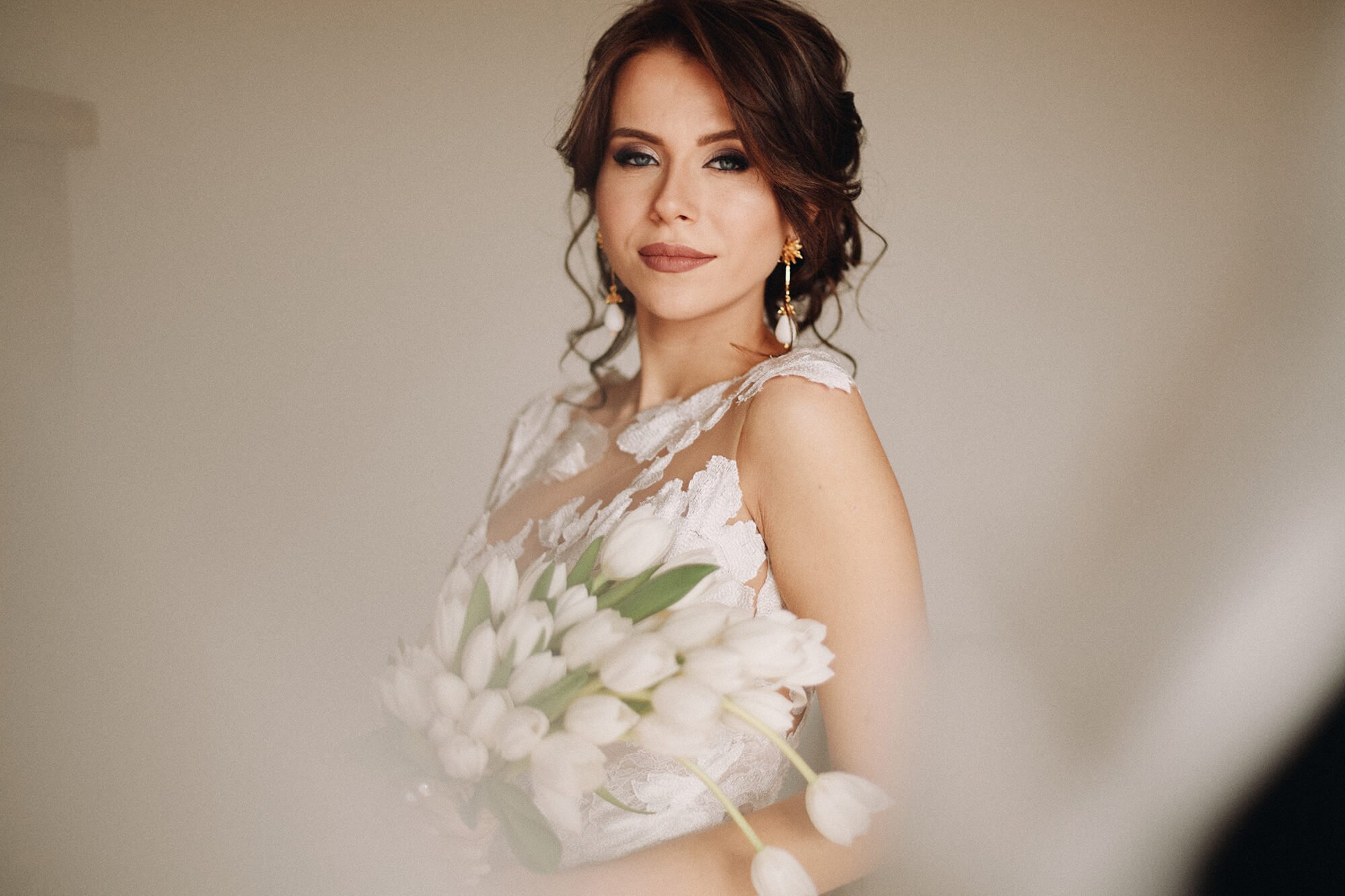 Bride holding bouquet for wedding portrait