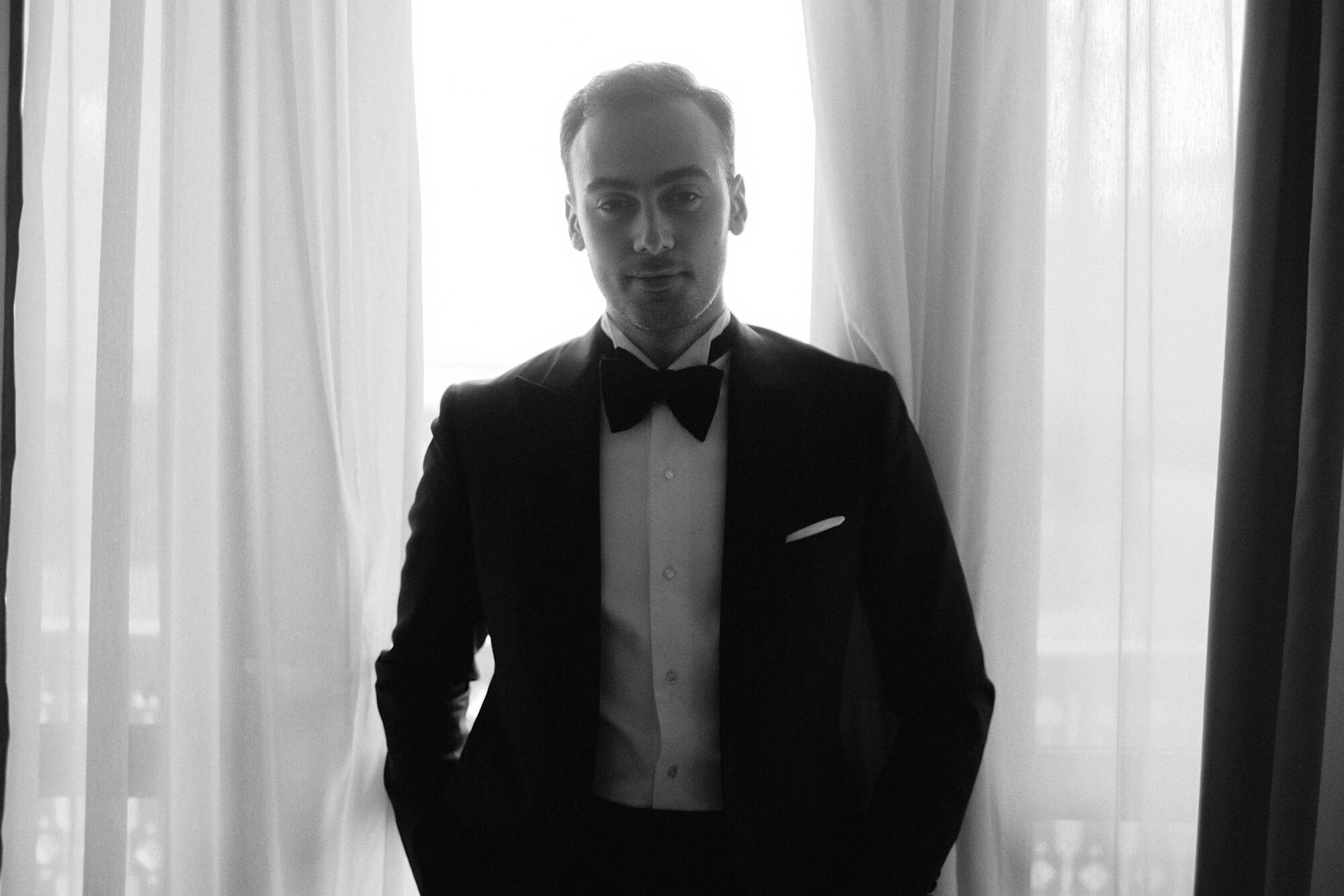 Groom preparation at hotel, black and white