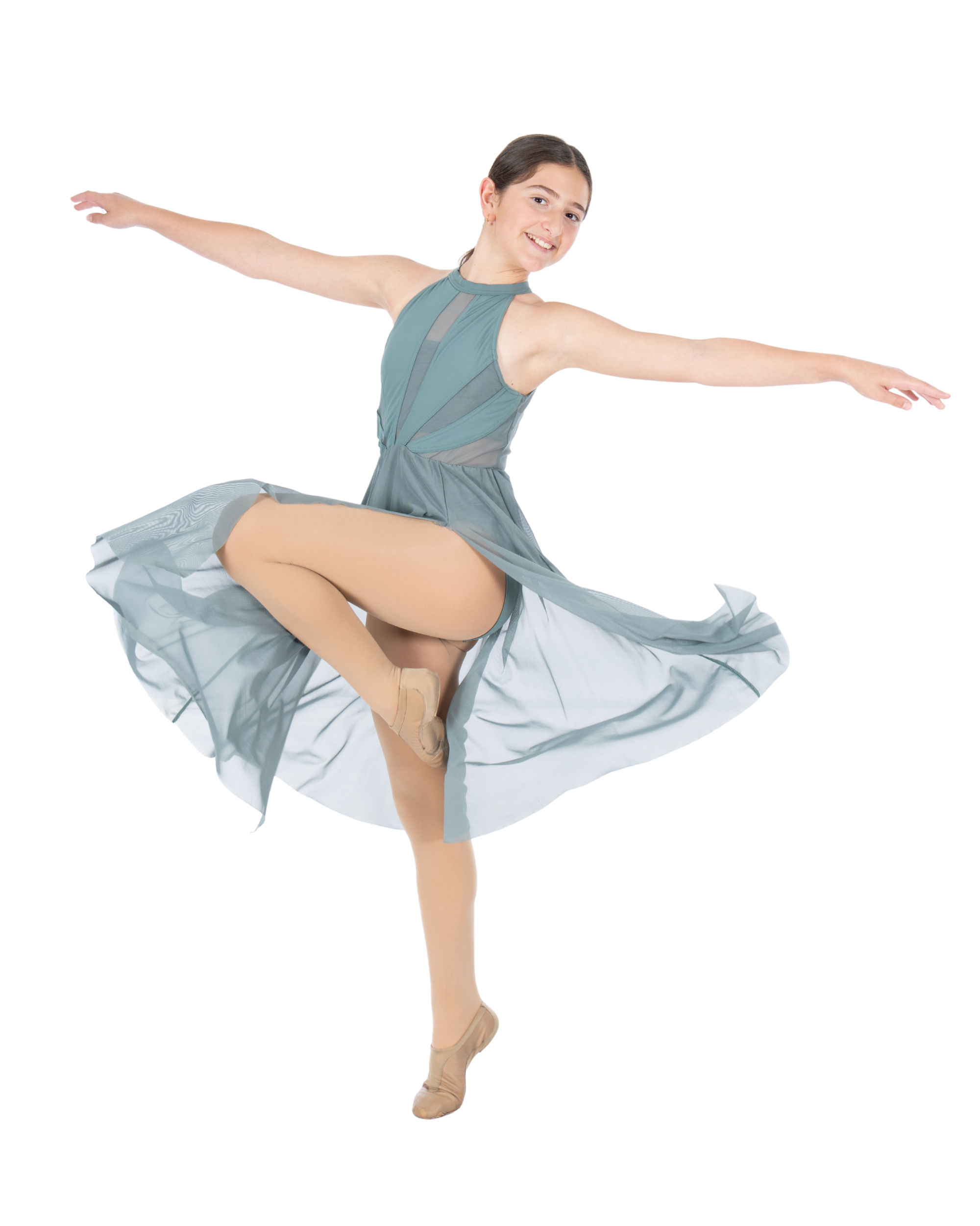 Young female ballet dancer in mid-spin, wearing a sleeveless teal dress and beige ballet slippers, with a pose balanced on one leg.