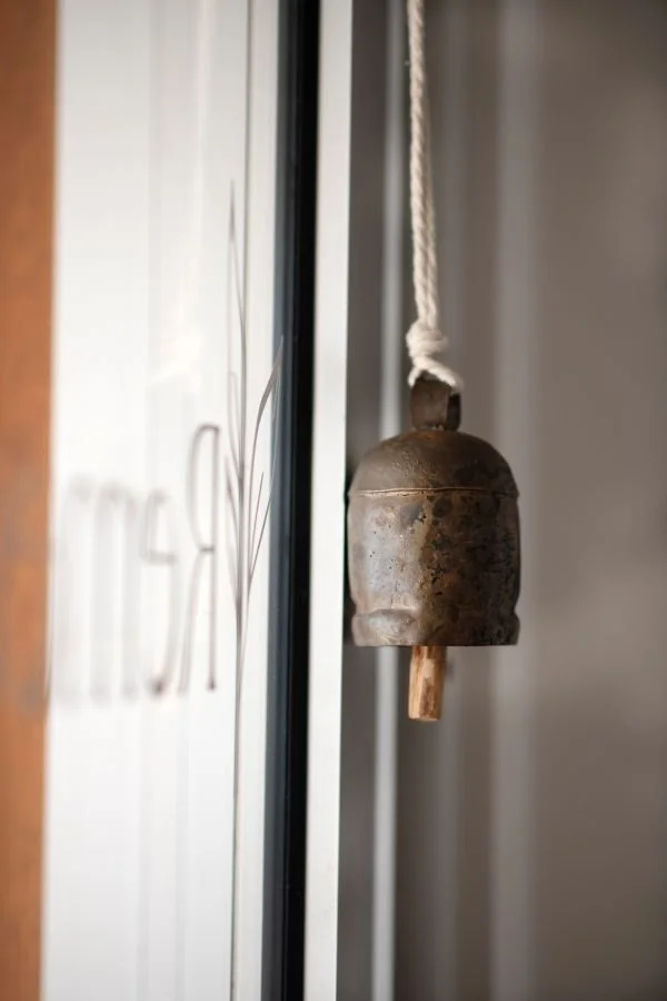 Image of a harmony bell and Remedy Natural Health sign
