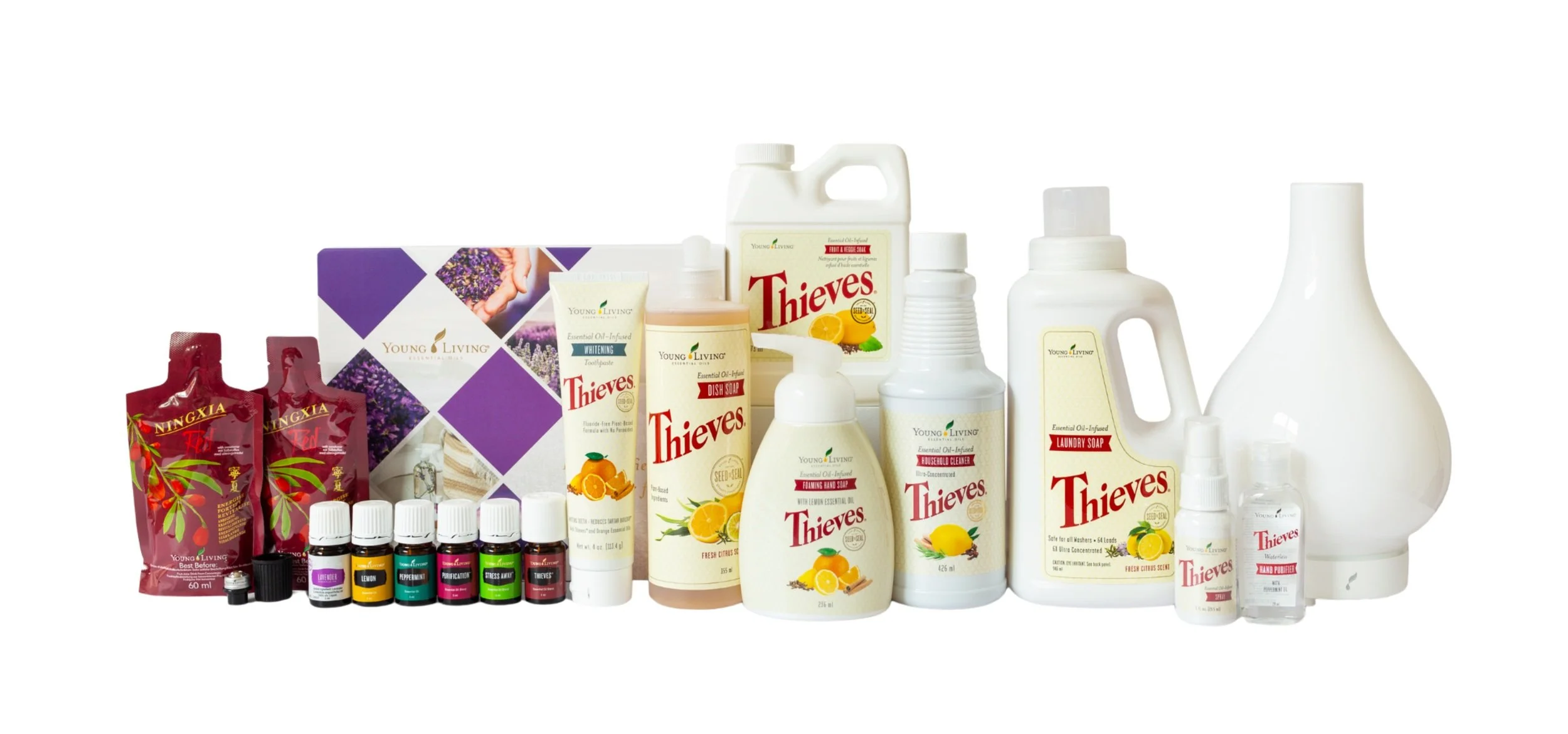 Collection of household cleaning products including Thieves brand cleaners, laundry soap, hand sanitizer, essential oils, and a white diffuser shaped like a vase.