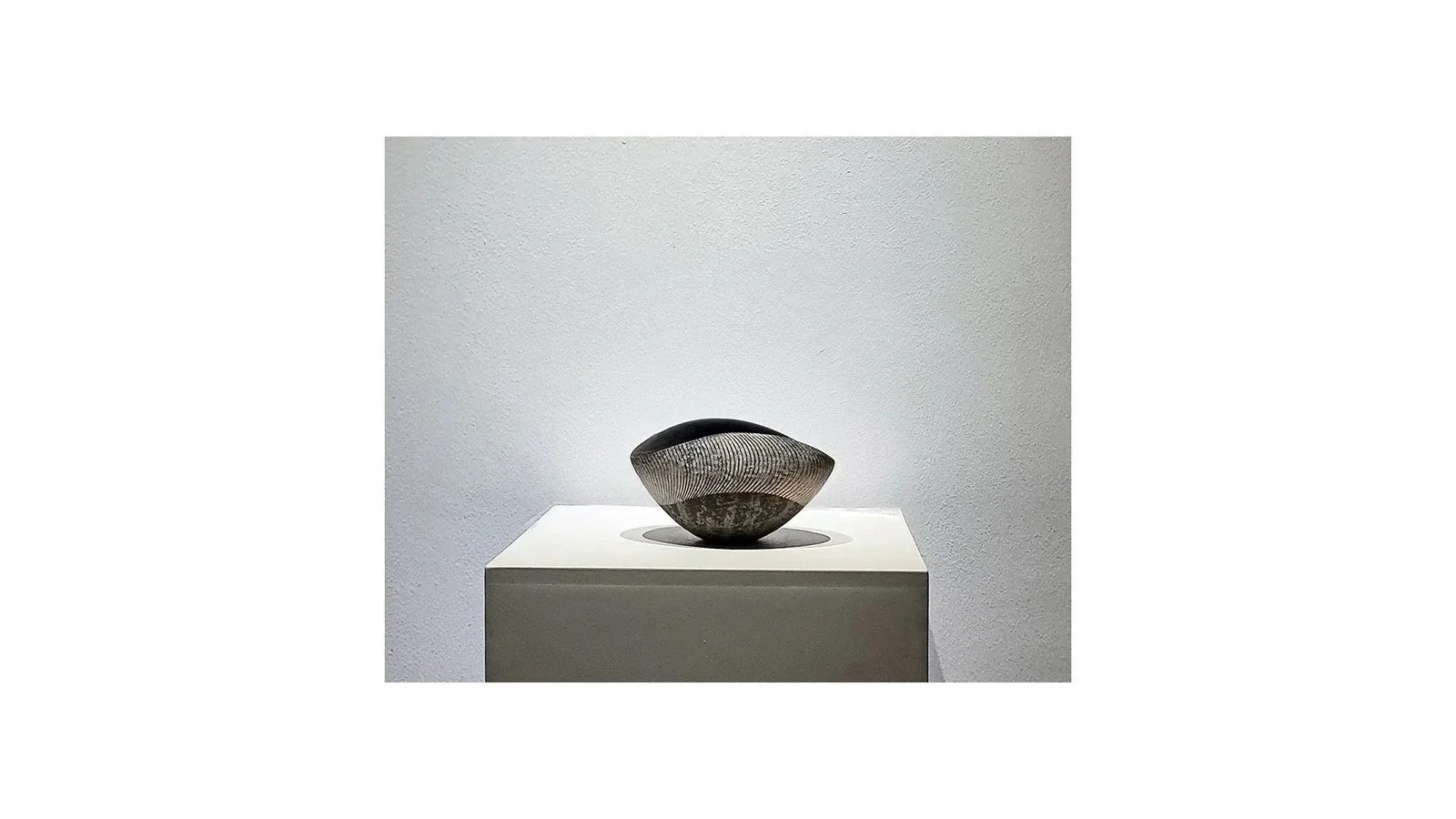 Iguchi Daisuke (b. 1975). Silver glazed tea bowl (2025), ceramic clay, metal oxide, clay ash, hulled ash, silver, H 8.5 cm x W 15.5 cm. 