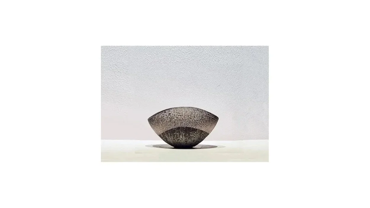 Iguchi Daisuke (b. 1975). Silver glazed tea bowl (2025), ceramic clay, metal oxide, clay ash, hulled ash, silver, H 8.5 cm x W 15.5 cm. 