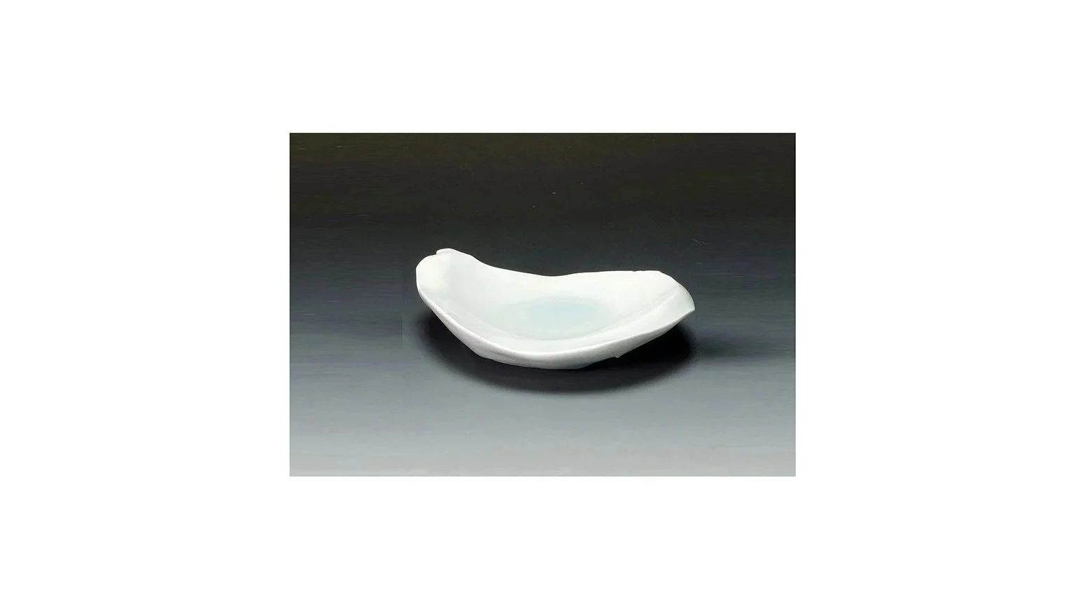 Kato Tsubusa (1962-2025). Irregular-shaped dish, hand-carved porcelain clay, pale blue celadon glaze, H 3 cm x W 14.6 cm and D 11.8 cm. 