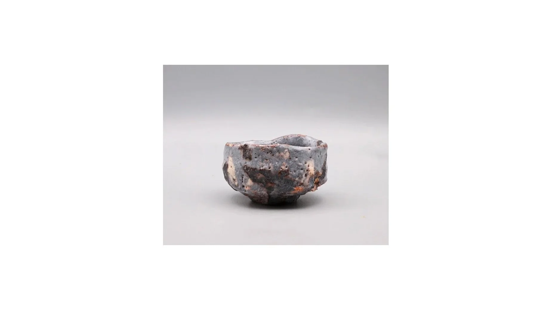 Seiki Kyoho. Clog-shaped Nezumi sake cups, hand-built stoneware, iron slip, white Shino glaze, H 4.7 cm x W 6.1 cm.