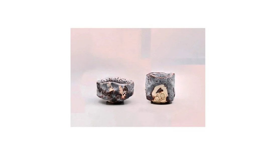 Seiki Kyoho. A pair of Nezumi sake cups, hand-built stoneware, iron slip, white Shino glaze.