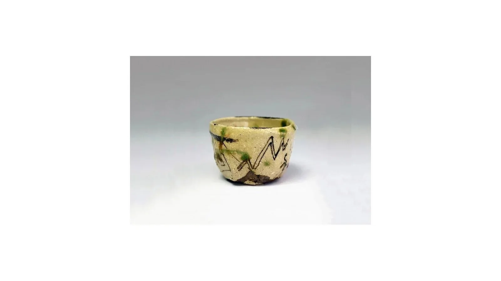 Suzuki Goro (b. 1941). Oribe sake cup with abstract designs, stoneware with copper-green and iron-oxide glazes, H 4.7 cm x W 7 cm. 