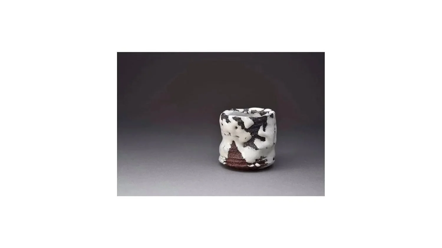 Miwa Kyusetsu XIII (b. 1951). Fuchfuchi cup (Cup of Deep Abundance). Hagi ware, Yakushiji earth, Hagi glaze, and specially formulated black glaze, H 7.5 cm x W 7 cm.