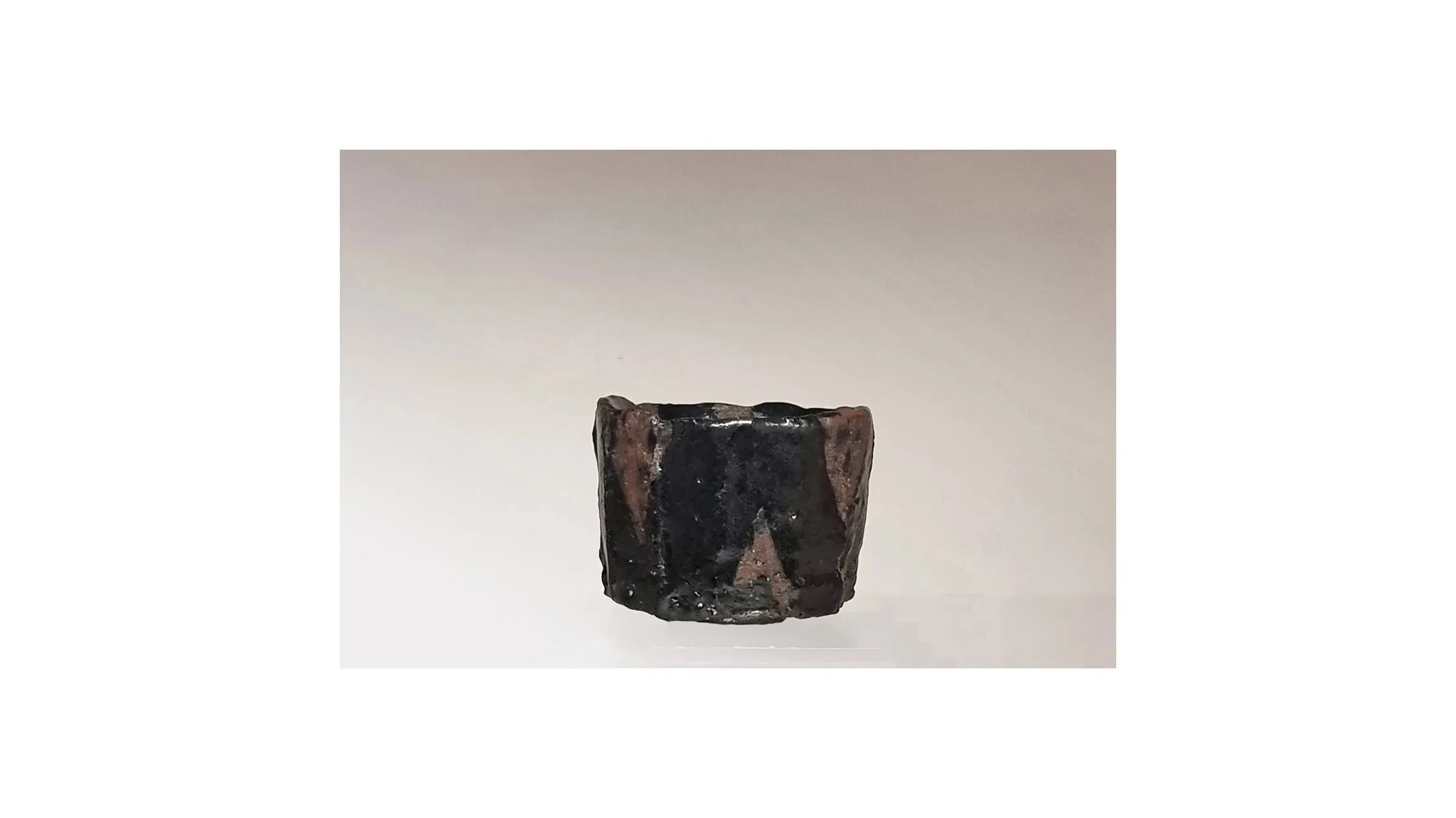 Yanashita Hideki (b. 1967). Black sake cup, hand-carved, fired by Raku technique, H 5.4 cm x W 6.8 cm. 