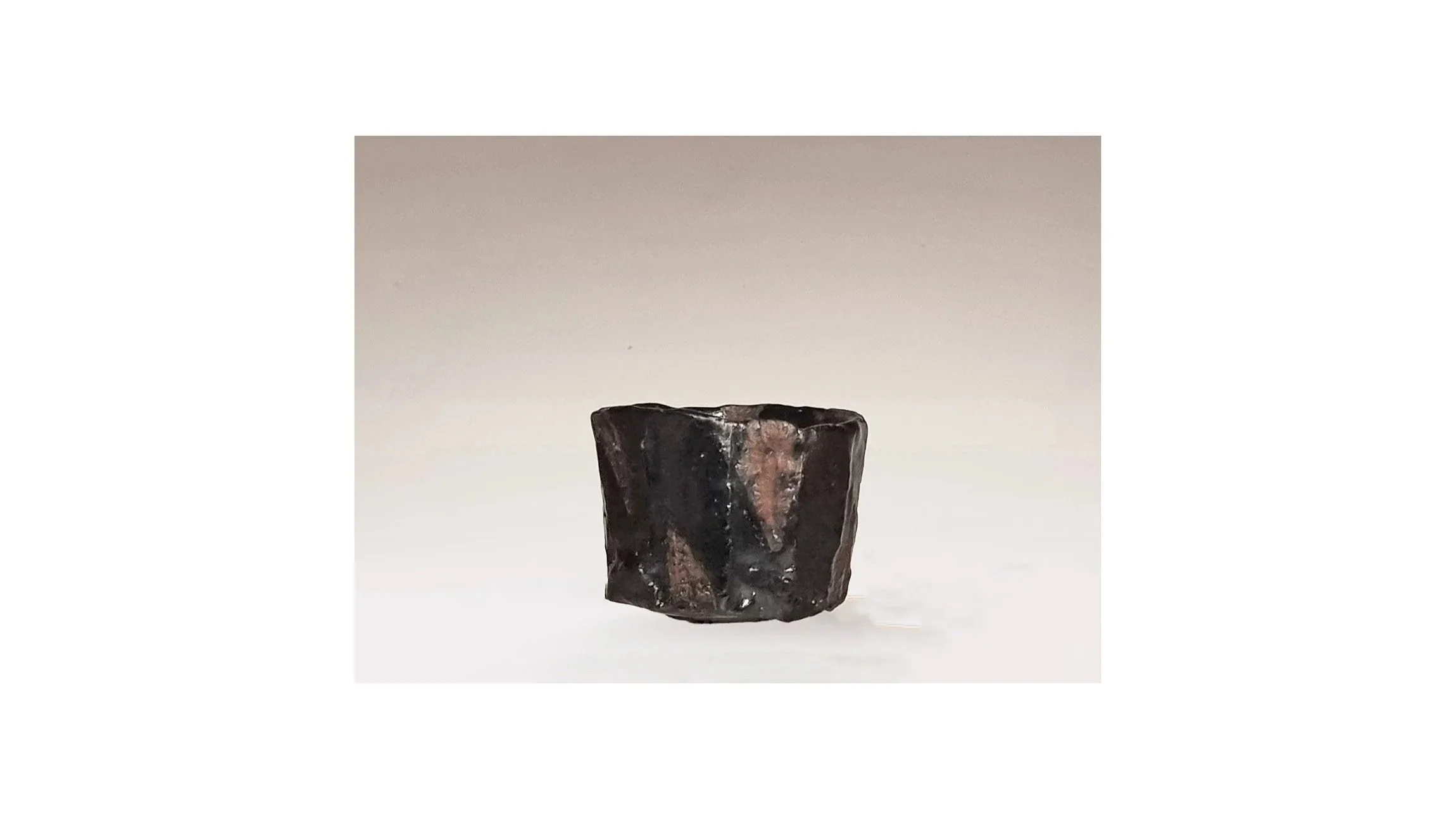 Yanashita Hideki (b. 1967). Black sake cup, hand-carved, fired by Raku technique, H 5.4 cm x W 6.8 cm. 