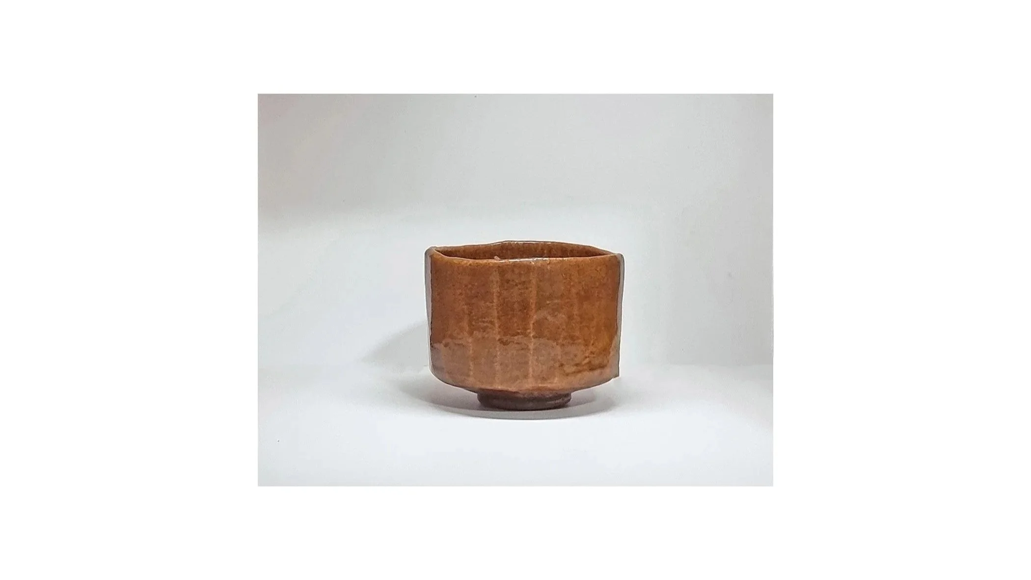 Sasaki Yamato (Sasaki Shoraku IV). Amber chawan with Mt Fuji scenery, Raku ware, H 8.5 cm x W 11.5 cm. 