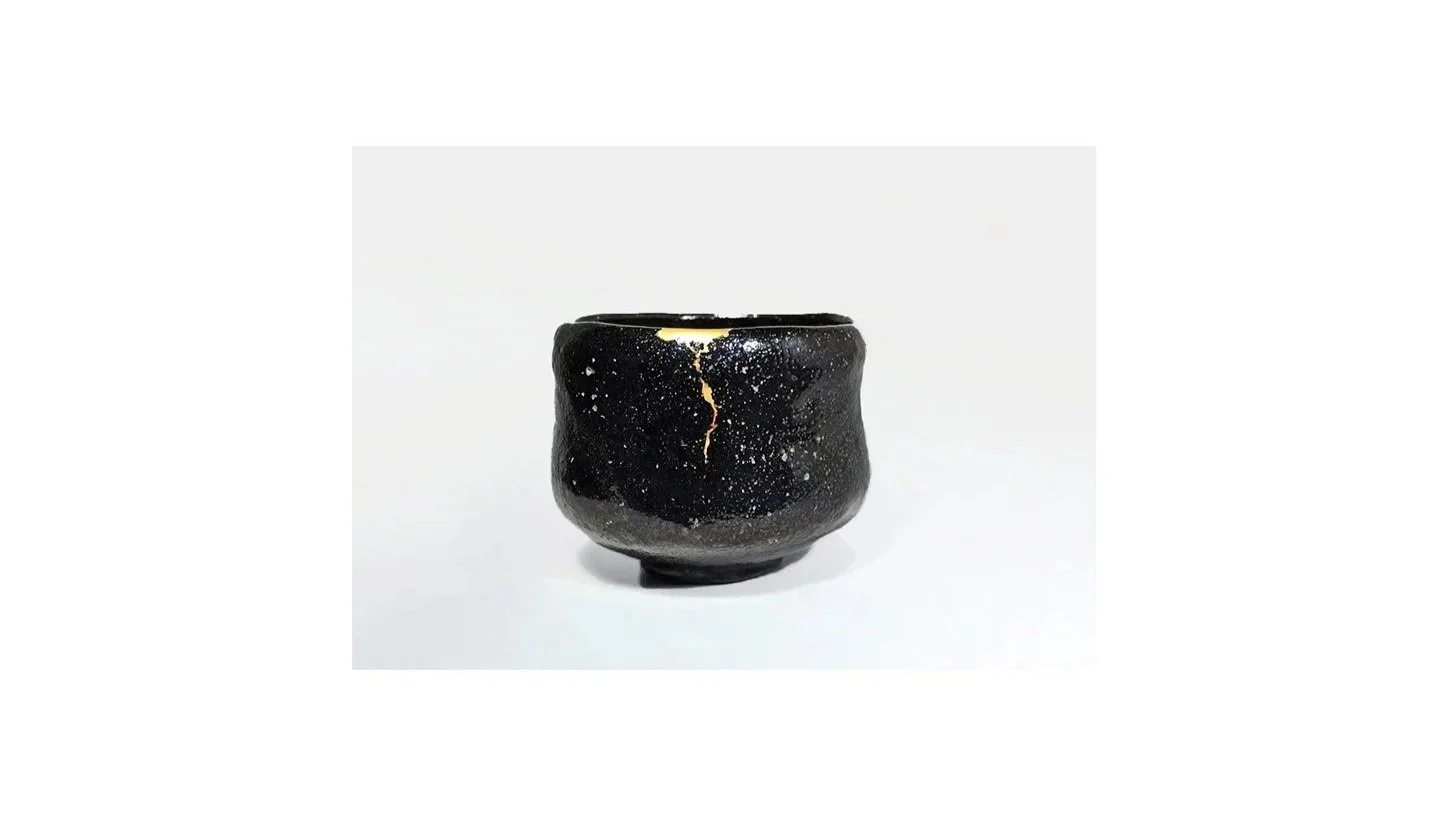 Artist unknown. Black Raku tea bowl with Kintsugi (gold and lacquer) repair, Edo period (1603-1868), H 8 cm x W 10 cm. 