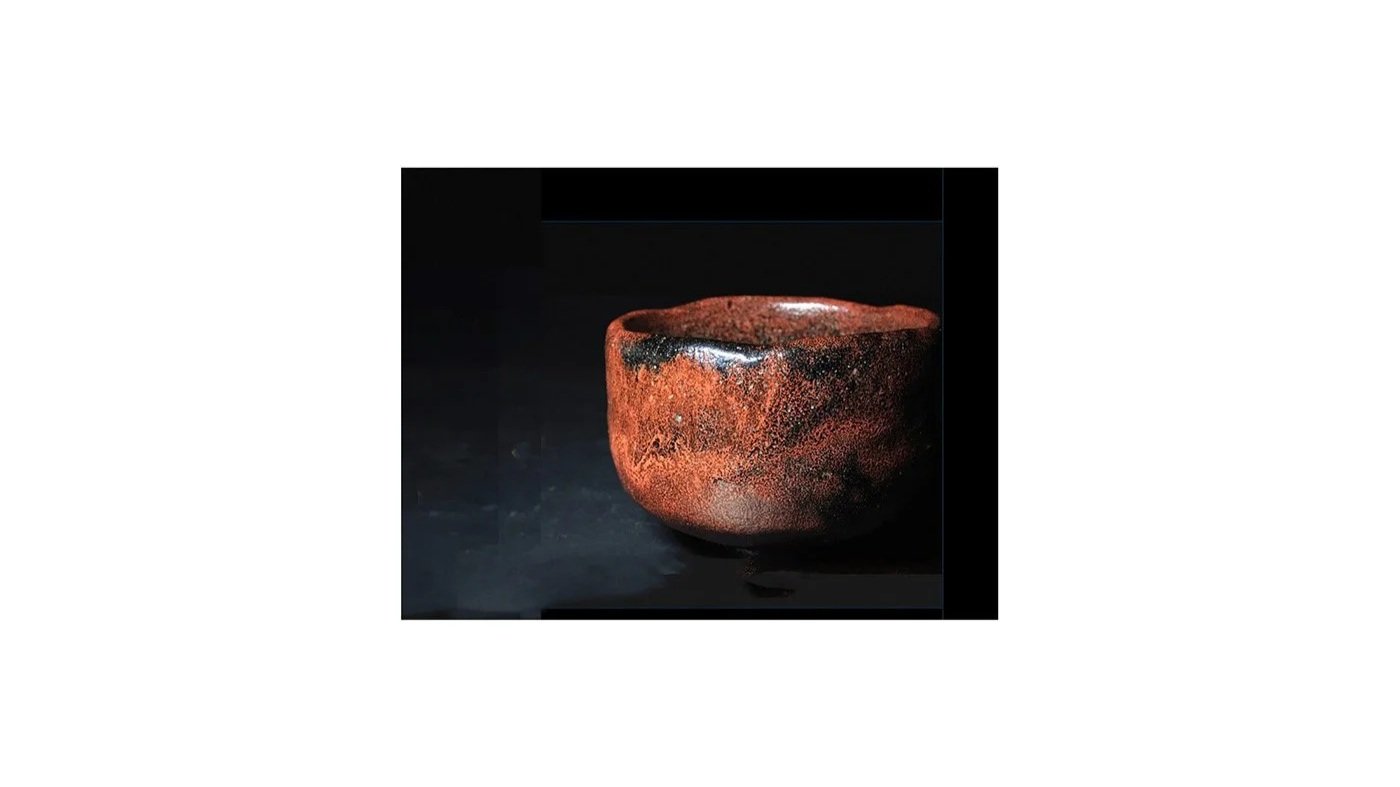 Raku Kichizaemon IV (Raku Ichinyu, 1640-1696), Black tea bowl with red glaze overlay, H 7.7 cm x W 11.3 cm.