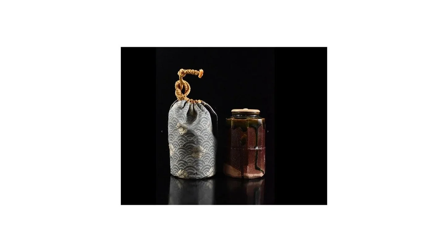The tea caddy pictured with a Shifuku, a hand-sewn silk pouch used to protect and present high-status tea caddies. 