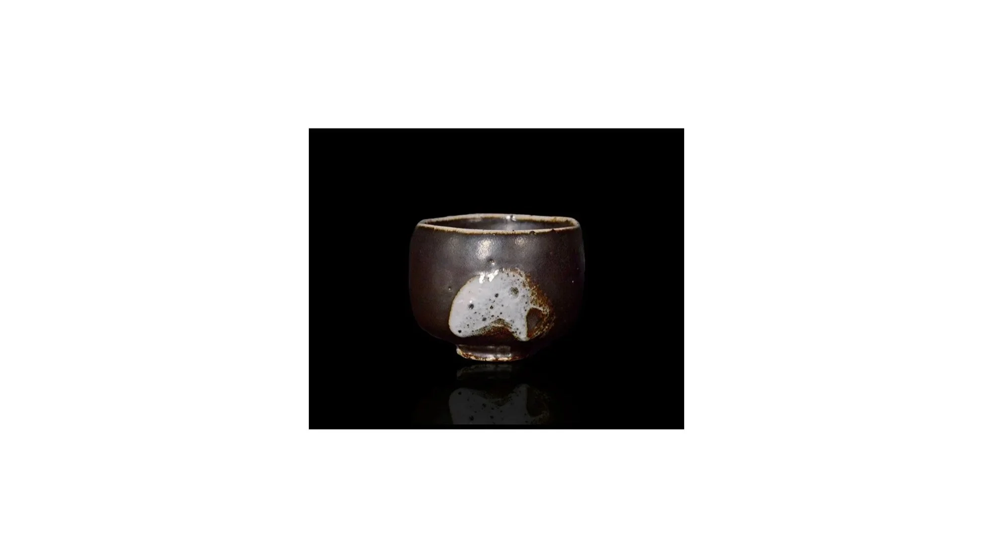 Daniel Seko (b. 1978), Black yohen tea bowl, stoneware with feldspar glaze, H 8.5 cm x W 11 cm.