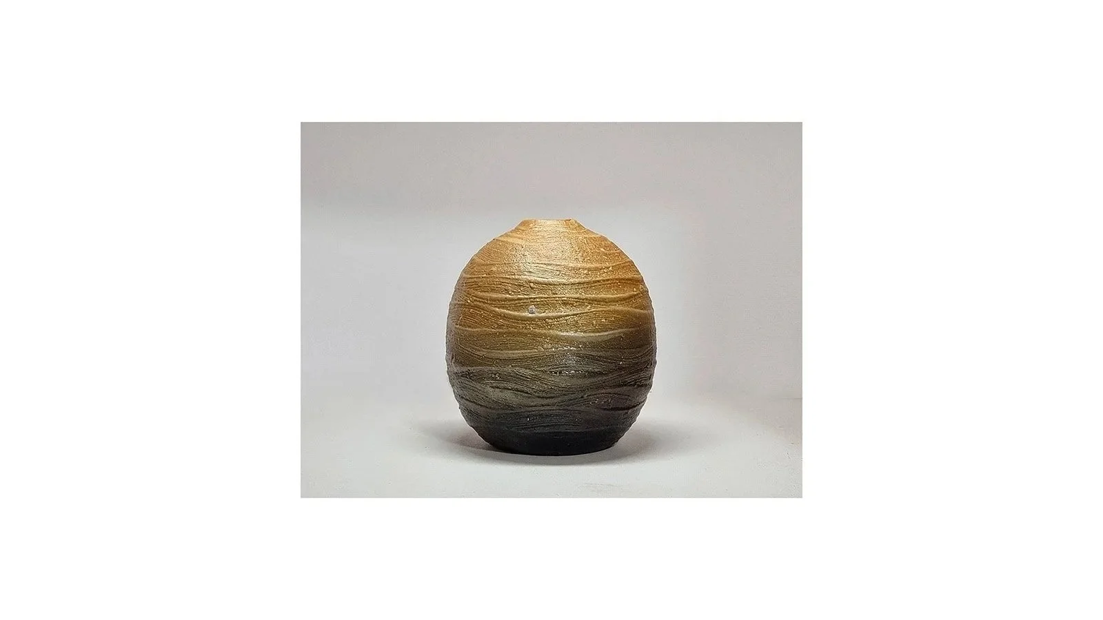 Haneishi Shuji (b. 1962), Carbonized vase with ripple patterns, Kasama ware, wood-fired with charcoal and salt glaze, H 11.5 cm x W 10 cm. 