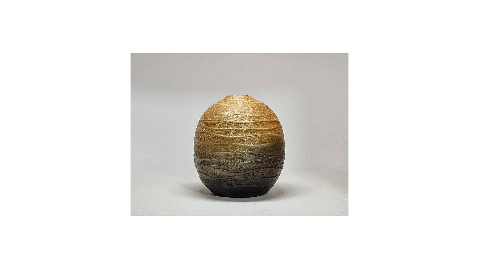 Haneishi Shuji (b. 1962), Carbonized vase with ripple patterns, Kasama ware, wood-fired with charcoal and salt glaze, H 11.5 cm x W 10 cm. 