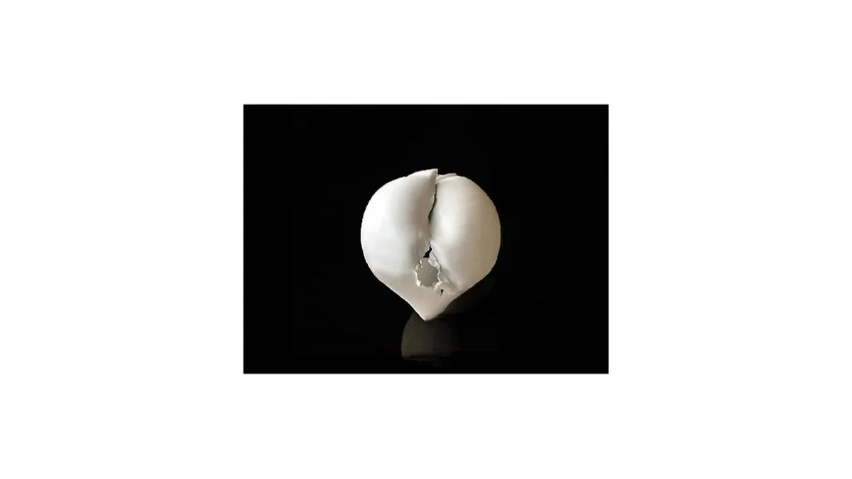 Murata Takuya (b. 1982), Torn vessel, porcelain with seihakuji glaze, H 17 cm x W 16 cm. 