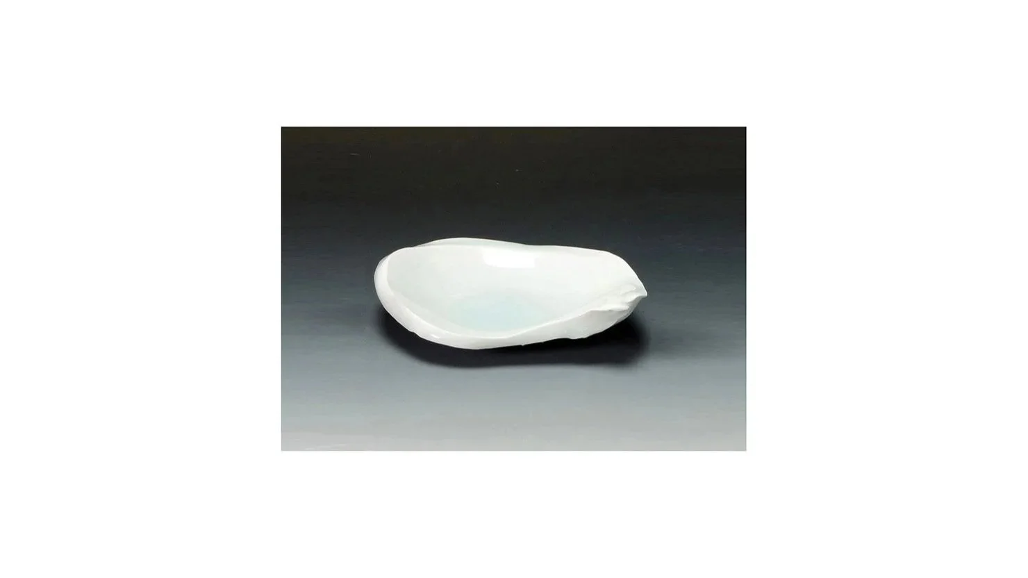 KATO Tsubusa (1962-2025), irregular-shaped dish, hand-carved porcelain clay, pale blue celadon glaze, H 3 cm x W 15 cm.