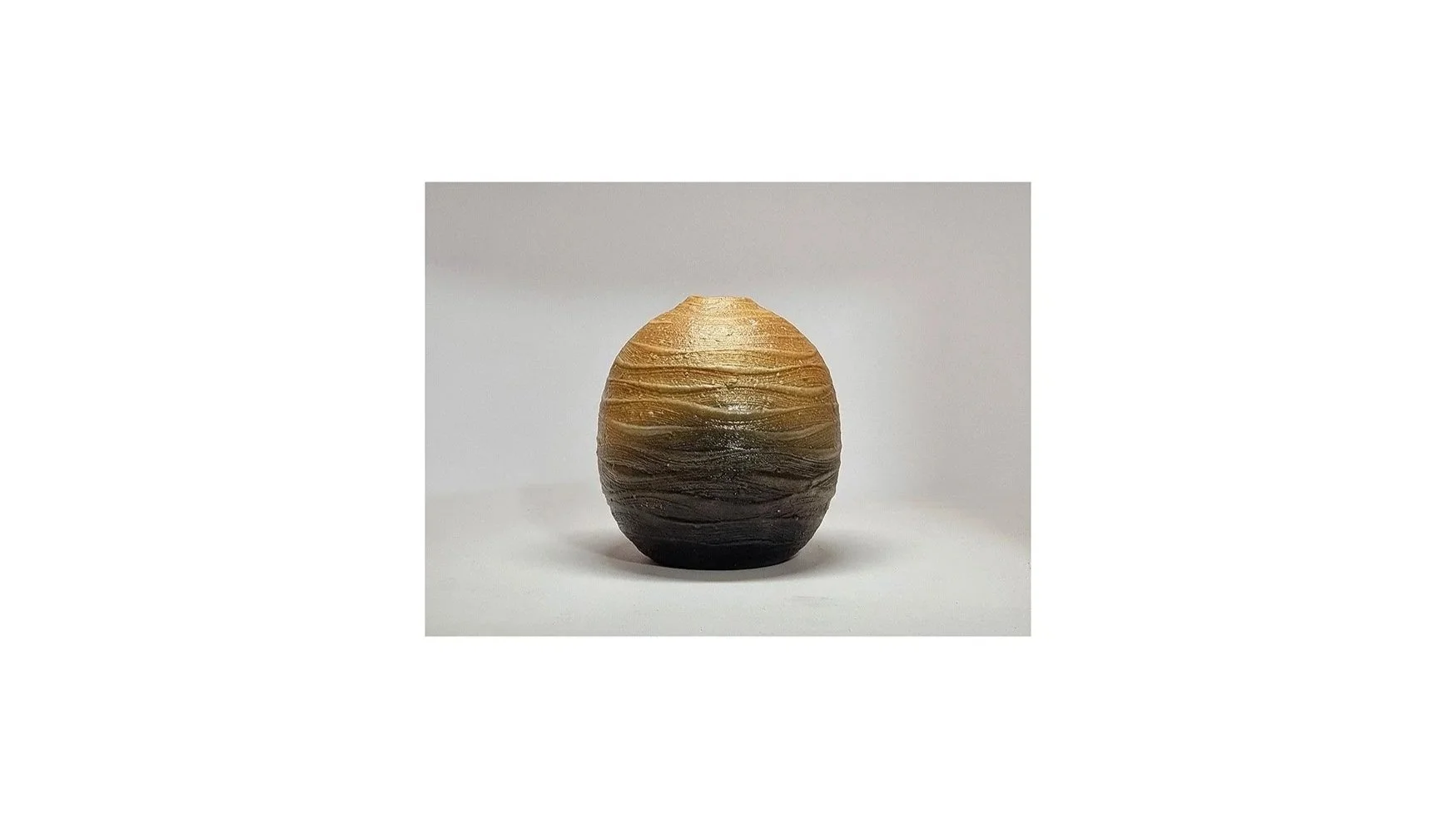 Haneishi Shuji (b. 1962), Carbonized vase with ripple patterns, Kasama ware, wood-fired with charcoal and salt glaze, H 11.5 cm x W 10 cm. 