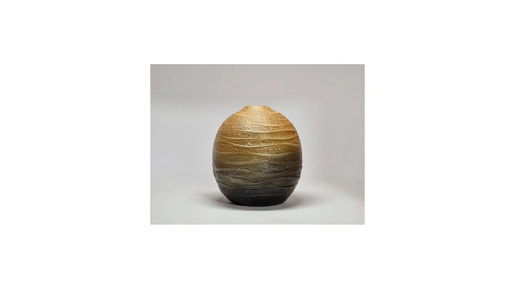 Haneishi Shuji (b. 1962), Carbonized vase with ripple patterns, Kasama ware, wood-fired with charcoal and salt glaze, H 11.5 cm x W 10 cm. 