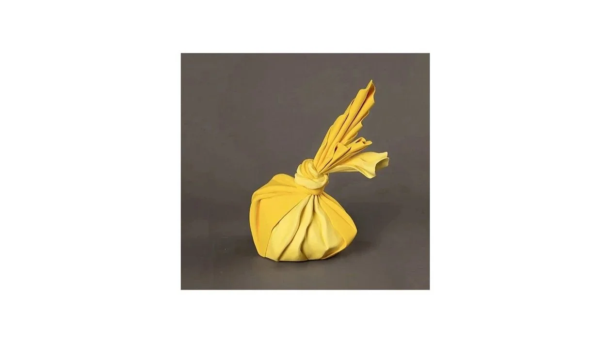 Tanaka Yu (b. 1989), Sculpture in the form of a wrapped bundle from the ‘Tsutsumimono’ series, coil-built stoneware with yellow slip, H 26 cm x W 21 cm x D 15 cm. 