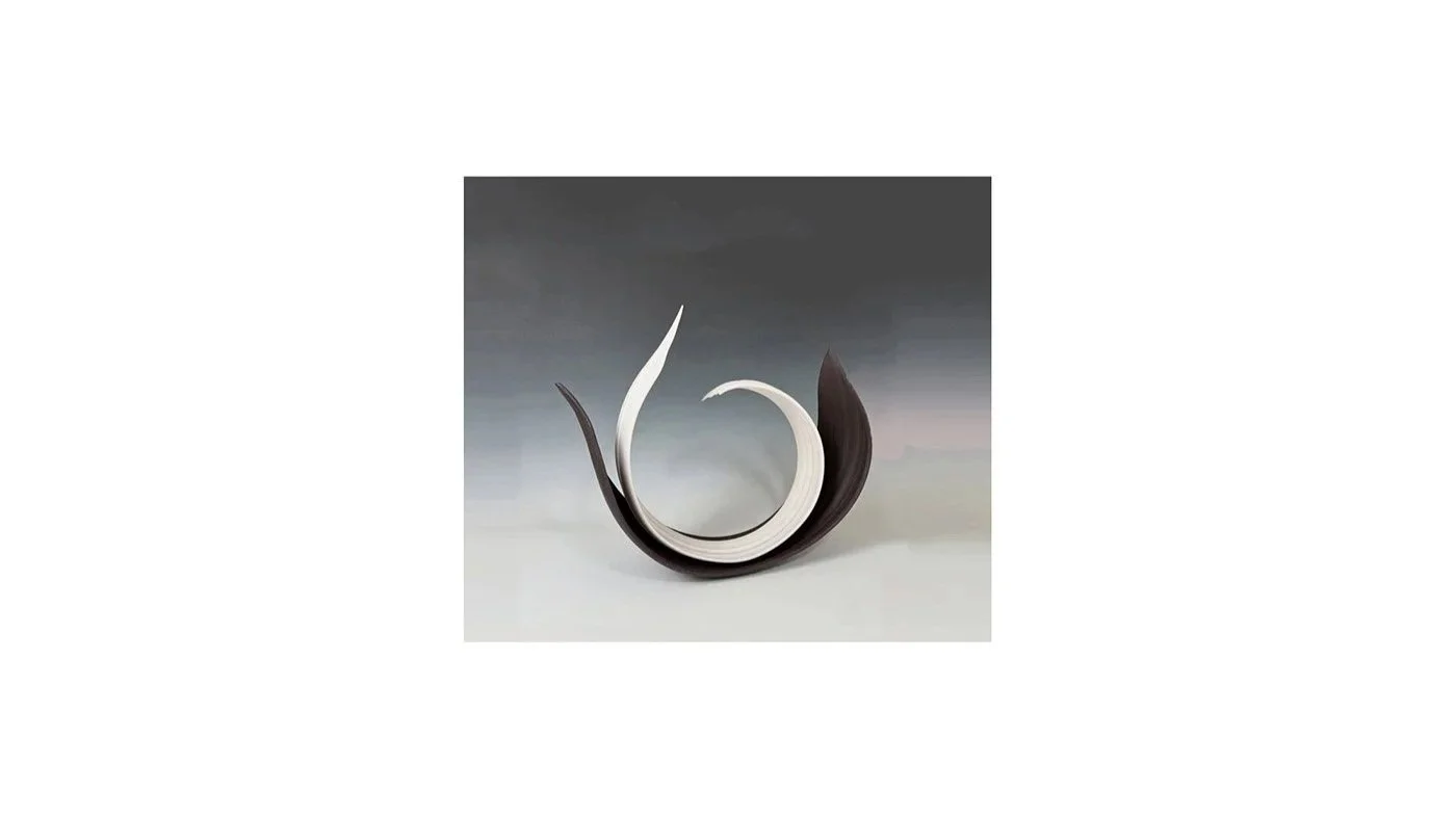 Yoshimura Atsuko, Curled sculpture entitled “Echo of a Circle”, from her “Black and White” series, wheel-thrown and hand-carved white porcelain and black stoneware, H 36 cm x W 36 cm x D 14 cm.
