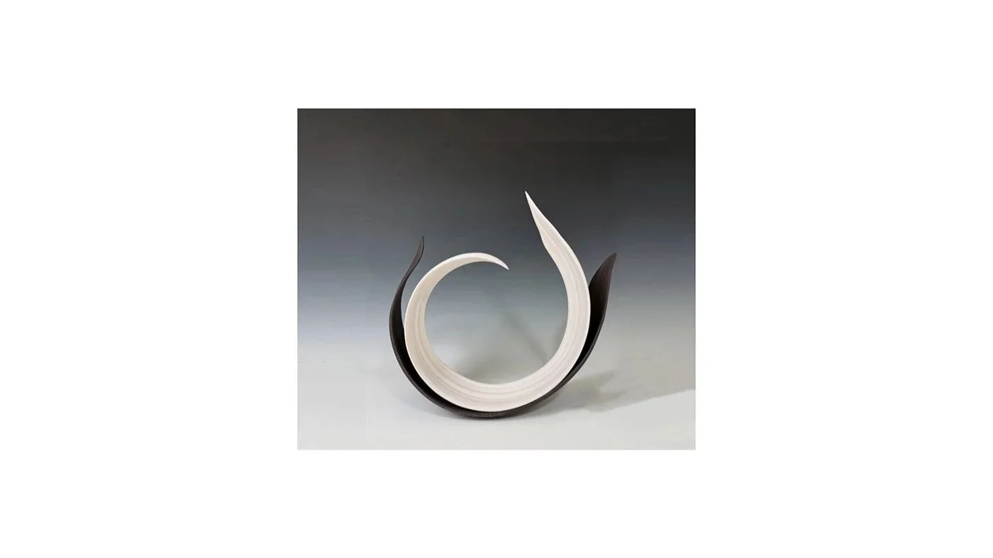 Yoshimura Atsuko, Curled sculpture entitled “Echo of a Circle”, from her “Black and White” series, wheel-thrown and hand-carved white porcelain and black stoneware, H 36 cm x W 36 cm x D 14 cm.
