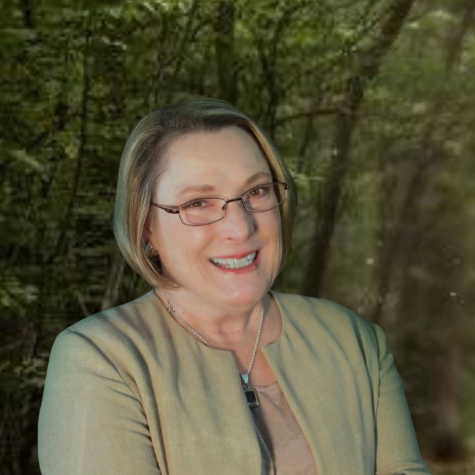 Deborah Sweaney, founder and president of the IRIS Literacy Project, smiling.
