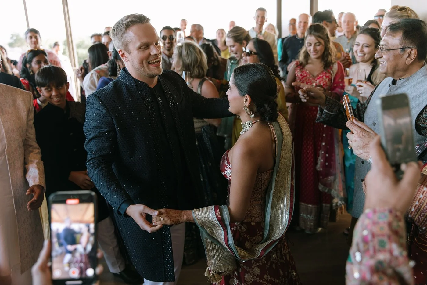 Bride and groom performing a traditional dance at their sangeet ceremony