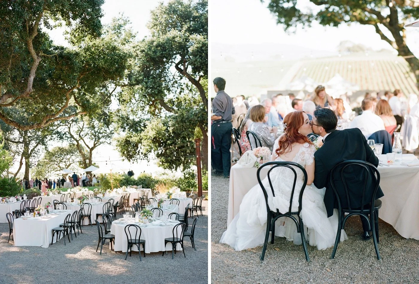 Bride and groom kissing during dinner at their wedding reception