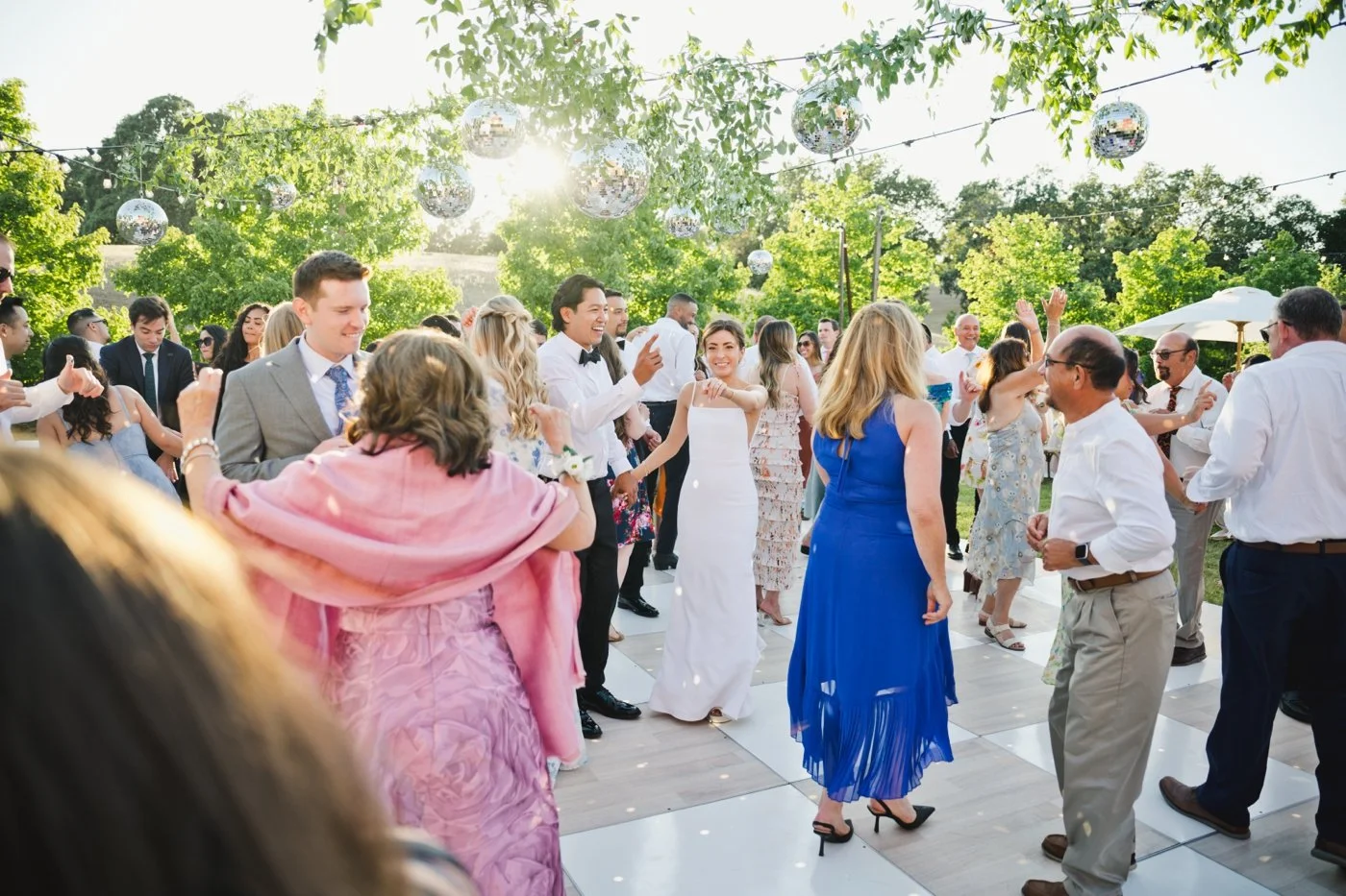 Bride and groom dancing with their wedding guests at Harper's Rest Winery
