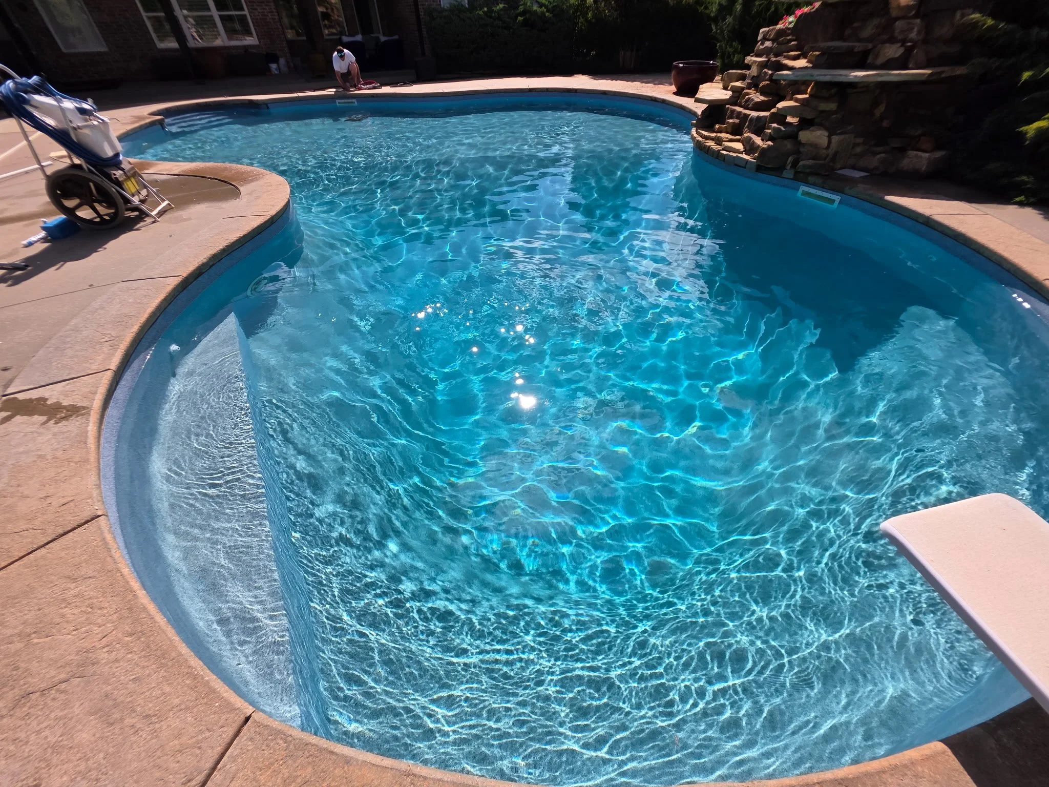 Deer Creek OK Pool Cleaning with pool vac sparkling blue water