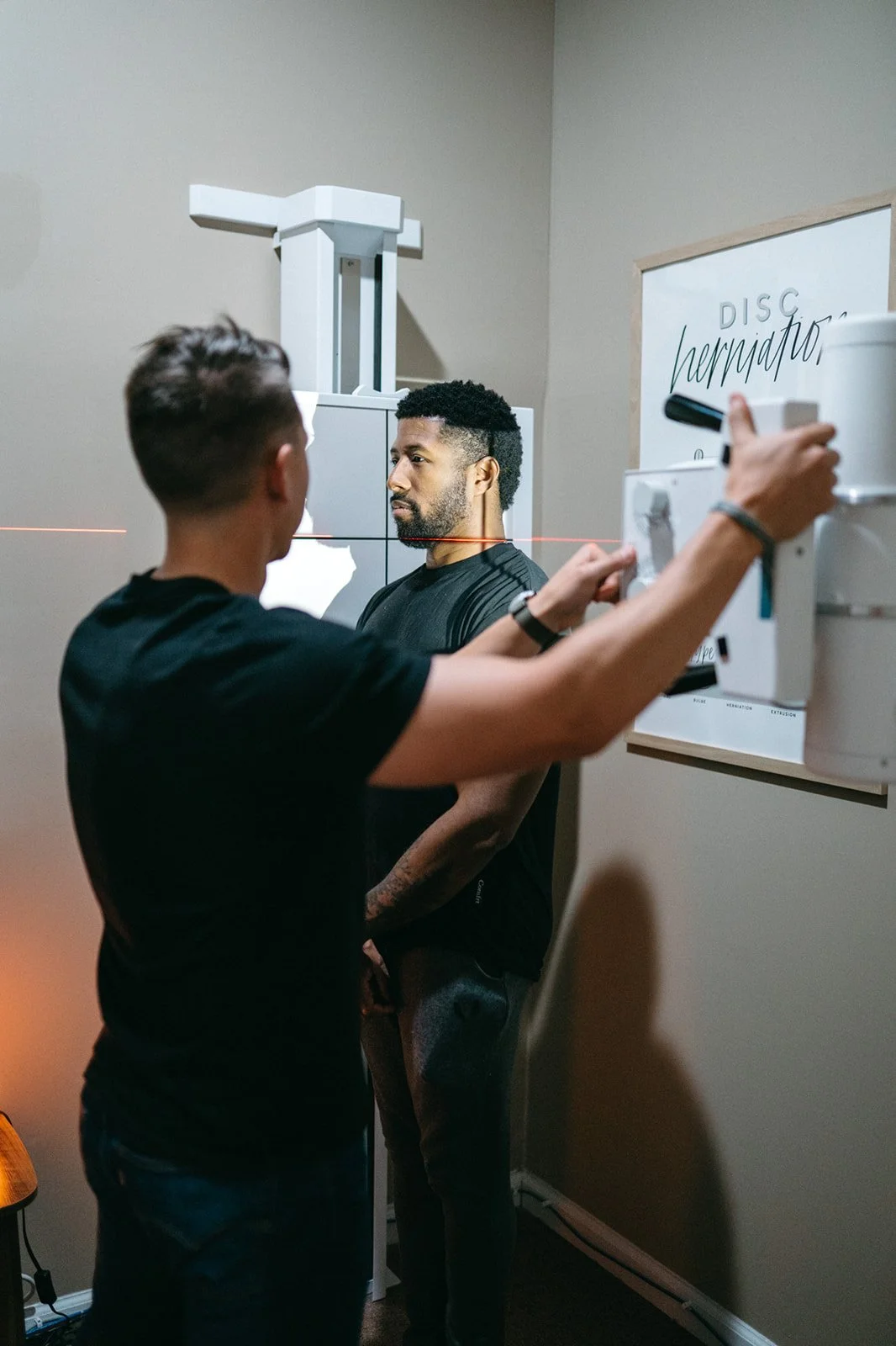 Dr. Josh Martin performing a spinal X-ray at Hometown Chiropractic & Wellness in Nolensville, Tennessee