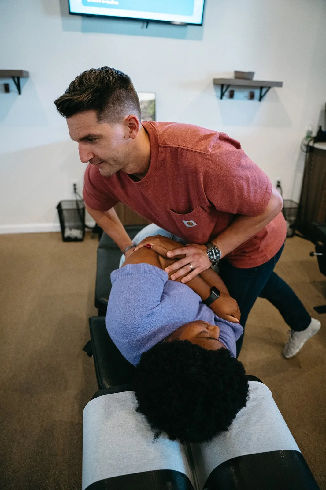 Dr. Josh Martin performing a spinal adjustment at Hometown Chiropractic & Wellness in Nolensville, TN.