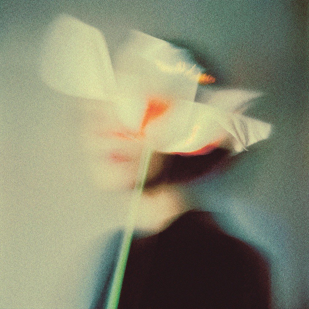 Close-up of a coffee cup with a saucer, on a table with a blurred background.