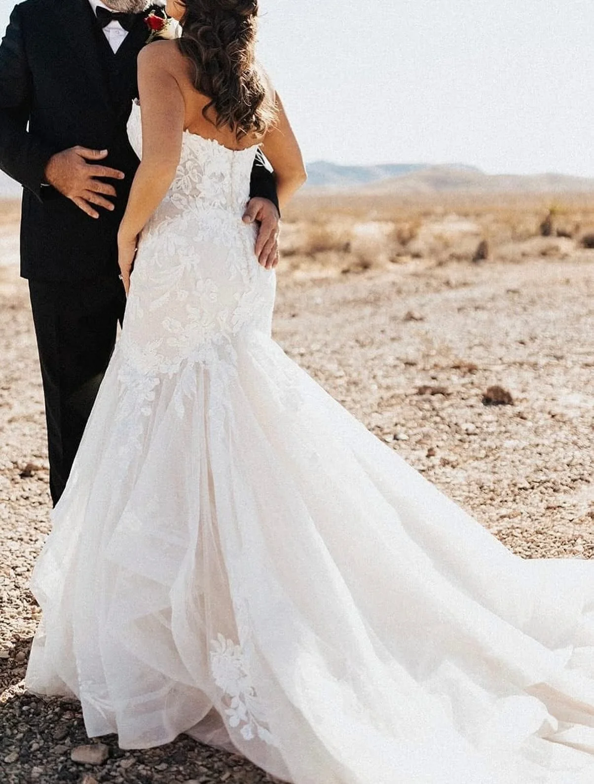 This stunning lace fit-and-flare will be available to try on at our next pop-up!
With its sculpted bodice, floral appliqu&eacute;, and dramatic train, it&rsquo;s made for that golden-hour glow! 
We&rsquo;ll be open July 9th from 6-8pm, walk in or mes