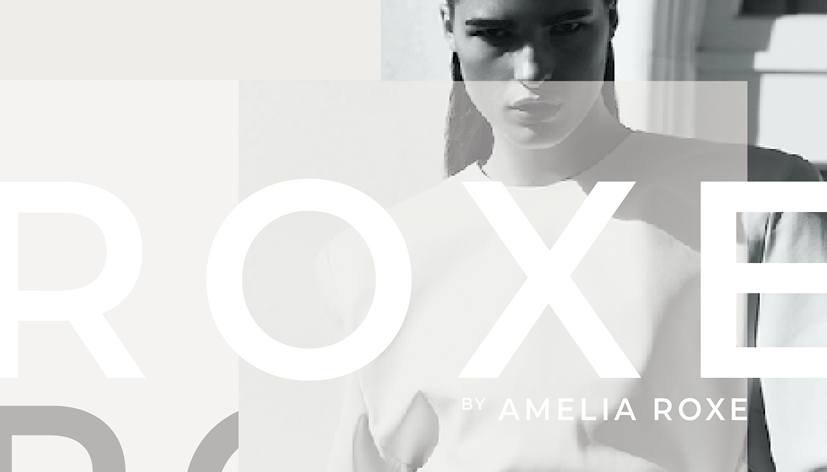 Black and white image of a woman with dark hair in a braid, wearing a white top, looking intensely at the camera. Overlayed with the text 'ROX' and 'BY AMELIA ROXE'.