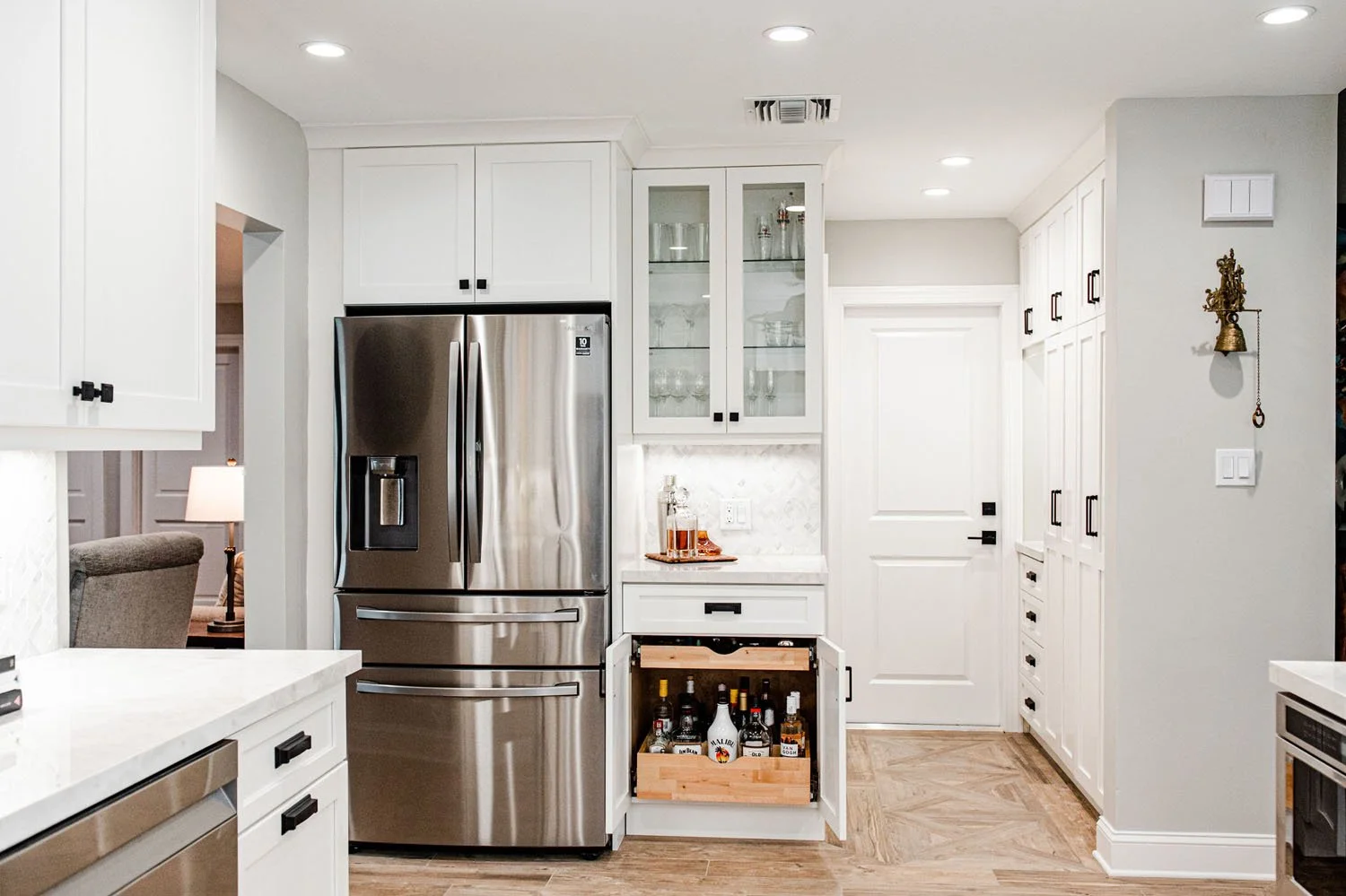 Refrigerator wall with pull-out bar cabinet and glass uppers