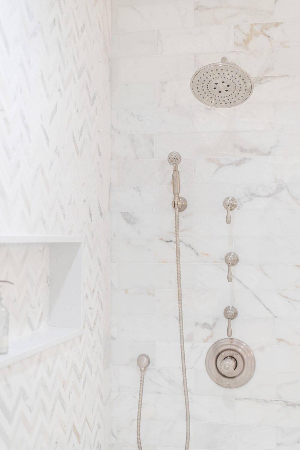 Marble shower with rain head and handheld shower