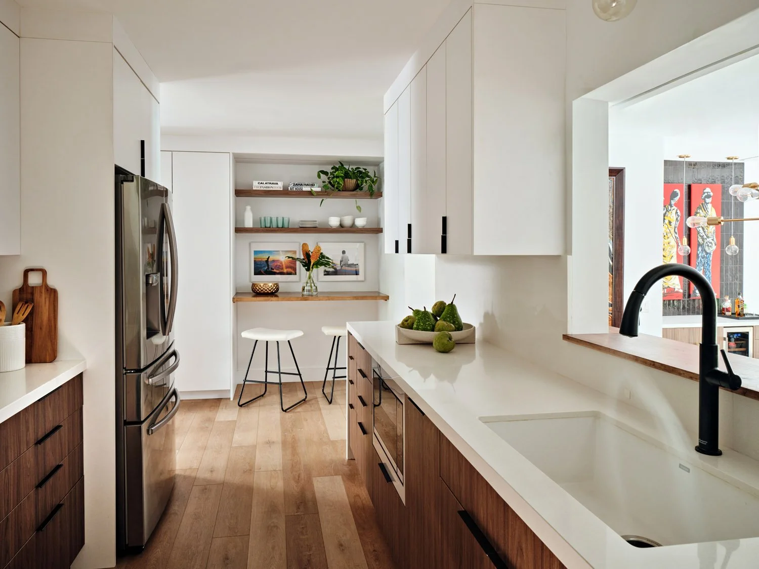 White and walnut galley kitchen with black faucet and open shelving
