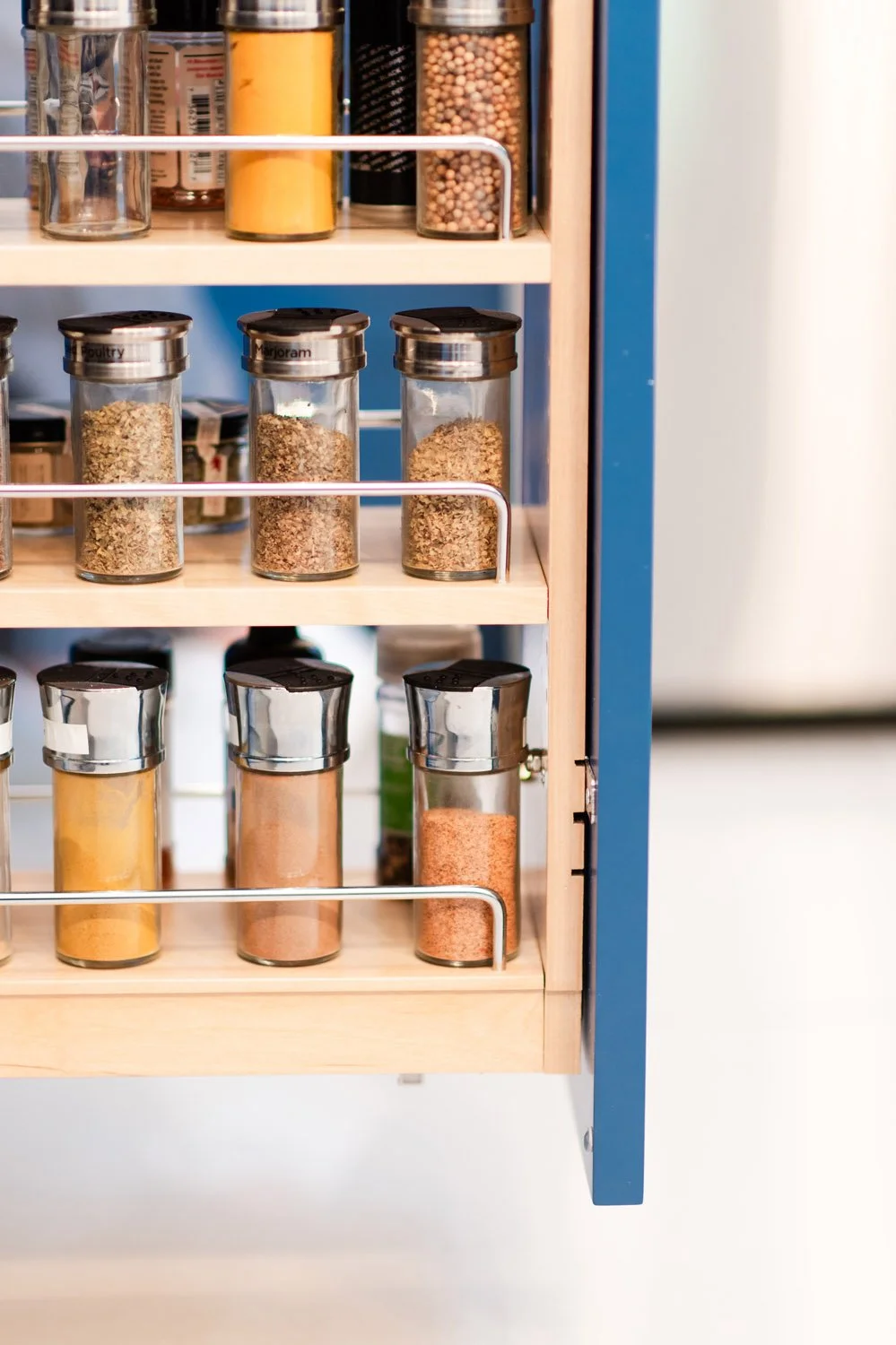 Pull-out pantry with glass jars and spices