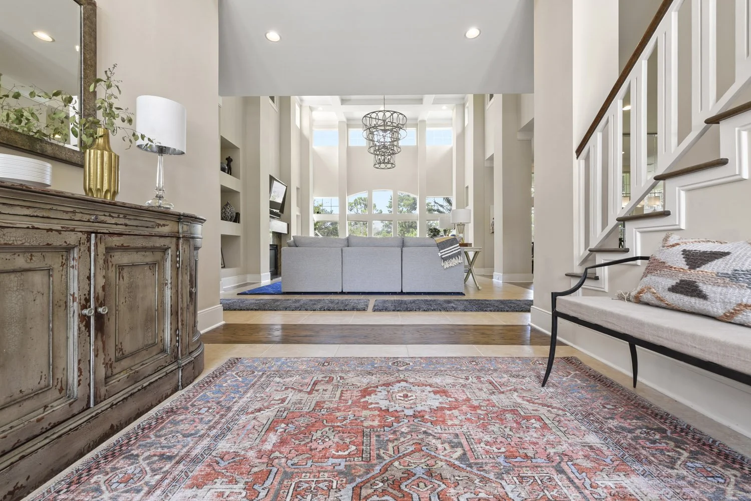 Foyer view past a wood console into the great room
